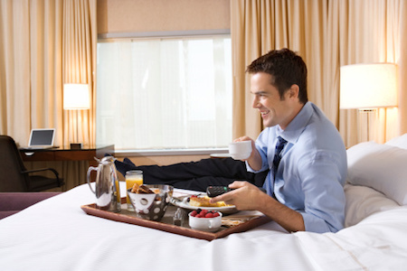 Man eating on bed
